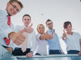 Photo of Business professionals giving a thumbs up